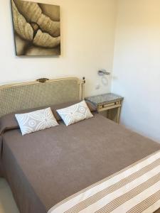 Postel nebo postele na pokoji v ubytování Hotel Marítimo Urban