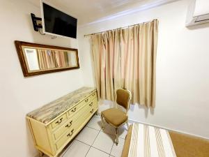 TV a/nebo společenská místnost v ubytování Hotel Marítimo Urban