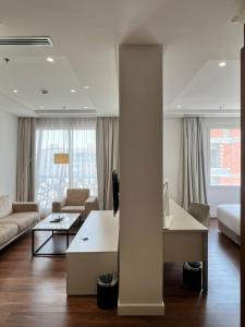 Postel nebo postele na pokoji v ubytování Landmark Hotel & Suites فندق وأجنحة لاندمارك