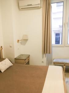 Postel nebo postele na pokoji v ubytování Hotel Marítimo Urban