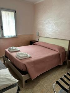 Postel nebo postele na pokoji v ubytování Scilla Resort