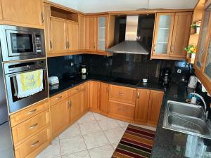 A kitchen or kitchenette at beautiful apartment near the beach