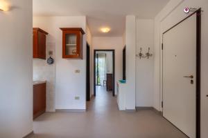 a hallway of a home with a hallway leading to a kitchen at Casa Letizia - Welchome in Rocca San Giovanni