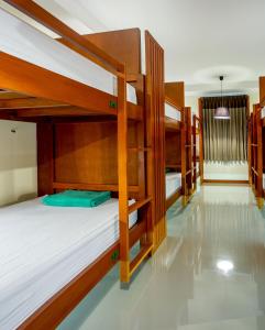 a group of bunk beds in a room at Phangan Pearl Hostel in Haad Rin