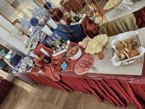 an overhead view of a table with cheese and other foods at Hotel Villa Rosa in Misano Adriatico