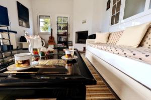 a living room with a couch and a coffee table at Ecoscape Luxury Villa Lamia in Lamía