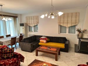 A seating area at beautiful apartment near the beach