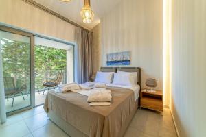 Postel nebo postele na pokoji v ubytování Pelagus Luxury Villas