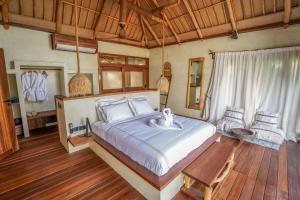 Postel nebo postele na pokoji v ubytování Casa Mikoko Resort