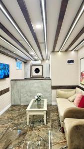 a living room with a couch and a table at Toprak City Hotel Antalya in Antalya +38 photos