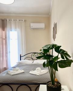 Katil atau katil-katil dalam bilik di Panos Apartment
