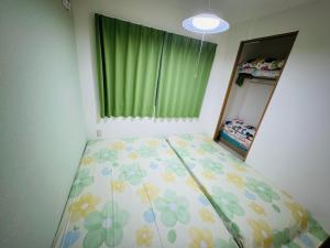 Postel nebo postele na pokoji v ubytování Vivere南5条
