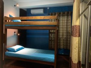 Ένα ή περισσότερα κρεβάτια σε δωμάτιο στο Paradise view hostel