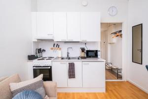 Η κουζίνα ή μικρή κουζίνα στο Elegant Studio in Downtown - Free Wi-Fi