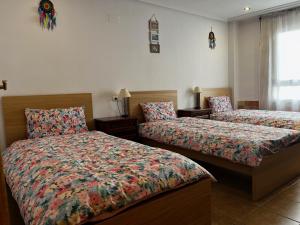 Ένα ή περισσότερα κρεβάτια σε δωμάτιο στο Apartament Layla La Mata