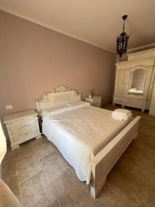 Postel nebo postele na pokoji v ubytování Agriturismo Tenuta Filippi