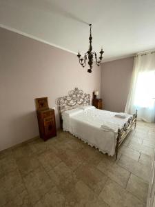 Postel nebo postele na pokoji v ubytování Agriturismo Tenuta Filippi