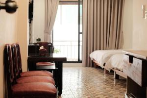 Postel nebo postele na pokoji v ubytování 莊同益民宿 Zhuang Tongyi Homestay