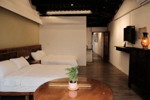 Postel nebo postele na pokoji v ubytování 莊同益民宿 Zhuang Tongyi Homestay