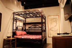 Postel nebo postele na pokoji v ubytování 莊同益民宿 Zhuang Tongyi Homestay