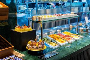 a buffet of food on display in a restaurant at Incheon Airport Transit Hotel Terminal 1 in Incheon