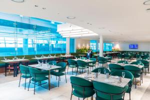 a dining room with tables and chairs at Incheon Airport Transit Hotel Terminal 1 in Incheon