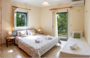 Postel nebo postele na pokoji v ubytování Nikis Country House - Lefkada BnB Private Parking