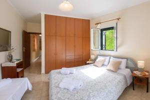 Postel nebo postele na pokoji v ubytování Nikis Country House - Lefkada BnB Private Parking