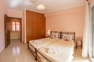 Postel nebo postele na pokoji v ubytování Nikis Country House - Lefkada BnB Private Parking