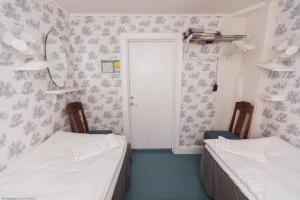 Postel nebo postele na pokoji v ubytování ÖlandsRo B&B