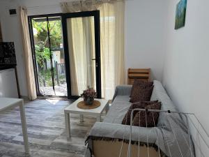 a living room with a couch and a table at Villa Sea House 3 in Byala