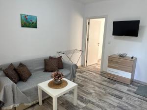 a living room with a couch and a table at Villa Sea House 3 in Byala
