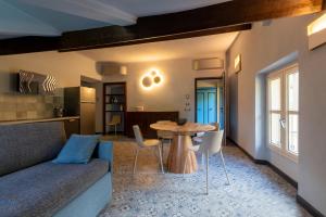 a living room with a couch and a table at Villa Rappis in Imperia