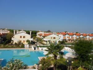 an aerial view of a resort with a swimming pool at Villa Caprera in Rosolina Mare