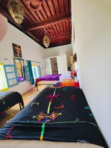 Postel nebo postele na pokoji v ubytování Le Retour au calme Maison d'hôtes
