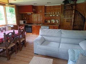 a living room with a couch and a table at Duplex Cerler in Cerler