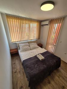 A bed or beds in a room at Apartmán TTT