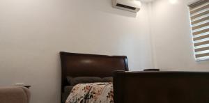 a bedroom with a bed and a chair and a window at Ahoyinn in Alcoy