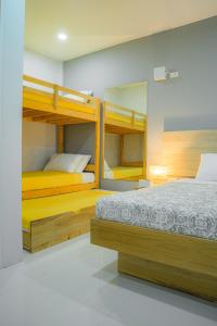 a bedroom with two bunk beds in it at Tropical Stay Accommodations Dao in Tagbilaran City