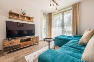 TV a/nebo společenská místnost v ubytování Azur Deluxe Apartment