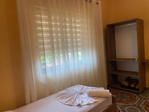 Ένα ή περισσότερα κρεβάτια σε δωμάτιο στο The Hideaway Guesthouse