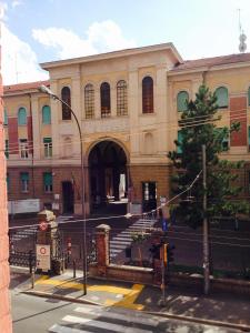 a large building with a staircase in front of it at A Casa di Lu Na in Bologna