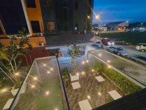 a rooftop view of a parking lot at night at The Grace Hotel in Muar