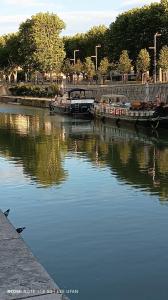 a group of boats docked in a body of water at T1 Bis - Centre Historique de Narbonne in Narbonne +3 photos