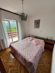 Postel nebo postele na pokoji v ubytování Apartment Ljubica