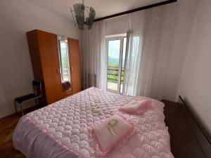 Postel nebo postele na pokoji v ubytování Apartment Ljubica