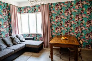 a living room with a couch and a table at Small Villa Subbi! in Tartu