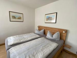 Ein Bett oder Betten in einem Zimmer der Unterkunft Rosenhof in Binz