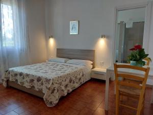 Postel nebo postele na pokoji v ubytování B&B SoleLuna