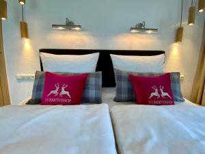 Letto o letti in una camera di Hubertushof